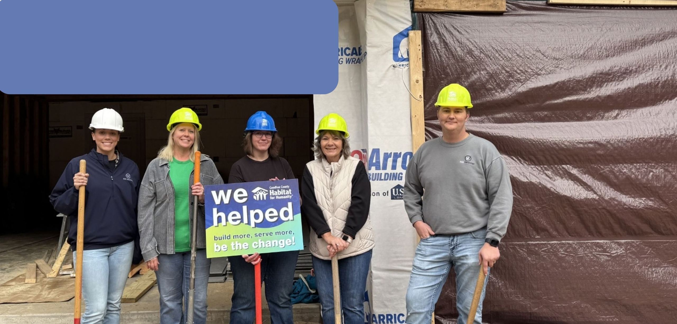 Volunteers posing at the construction site